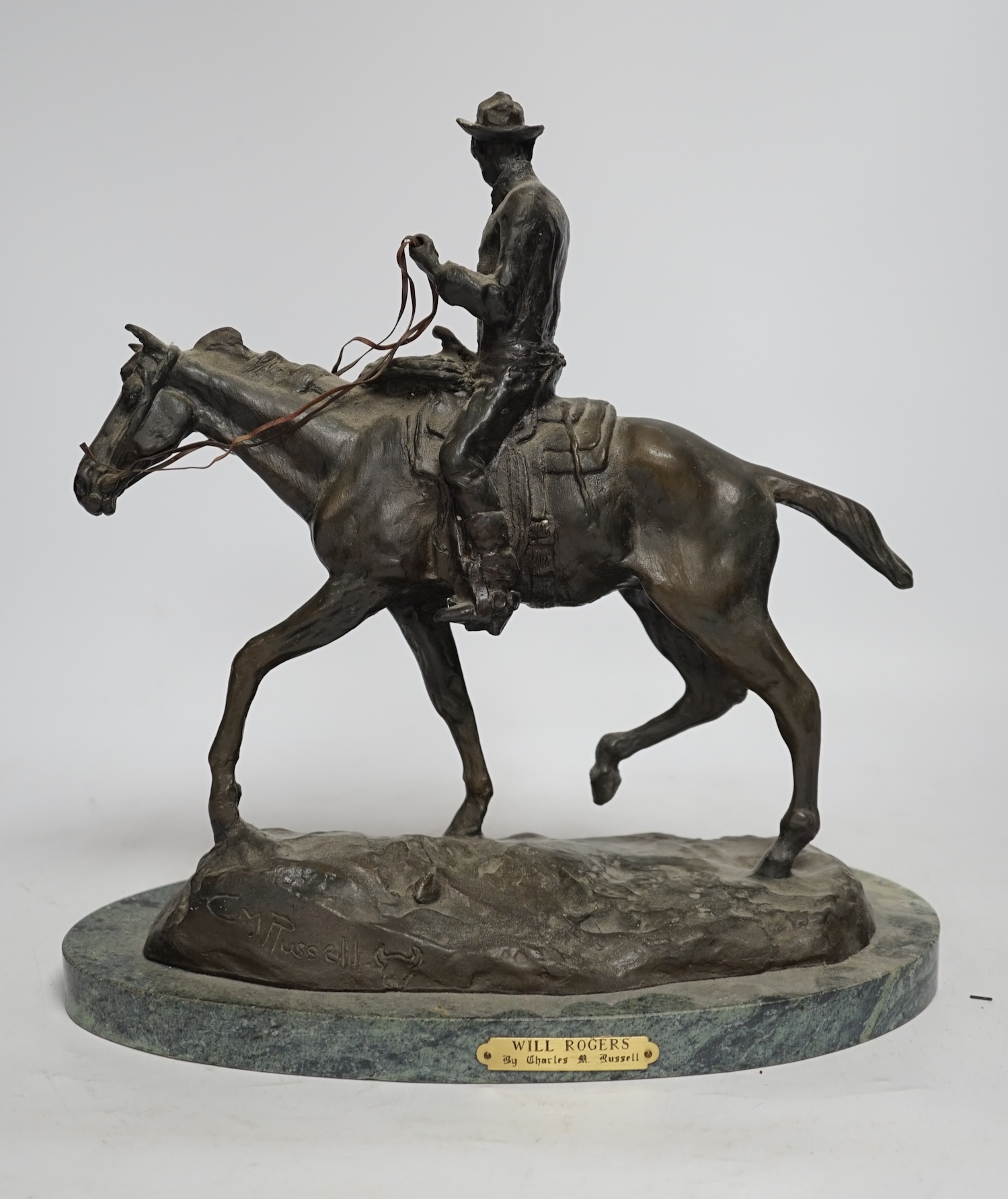 After Charles Marian Russell, a bronze group of Will Rogers, 29cm high